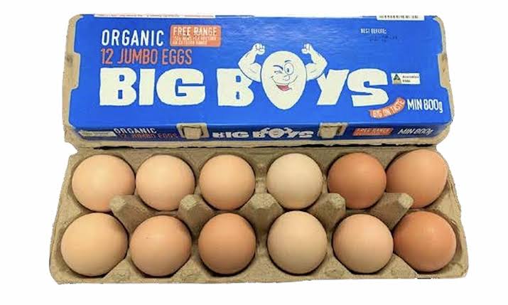 A cardboard carton of Big Boys brand organic 12 jumbo eggs, with the blue branded lid propped open above a brown paper egg tray holding twelve eggs on a white background.