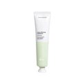 Tube of green toothpaste on a white background