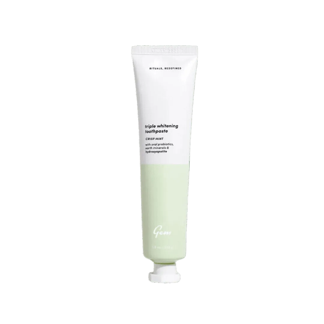Tube of green toothpaste on a white background