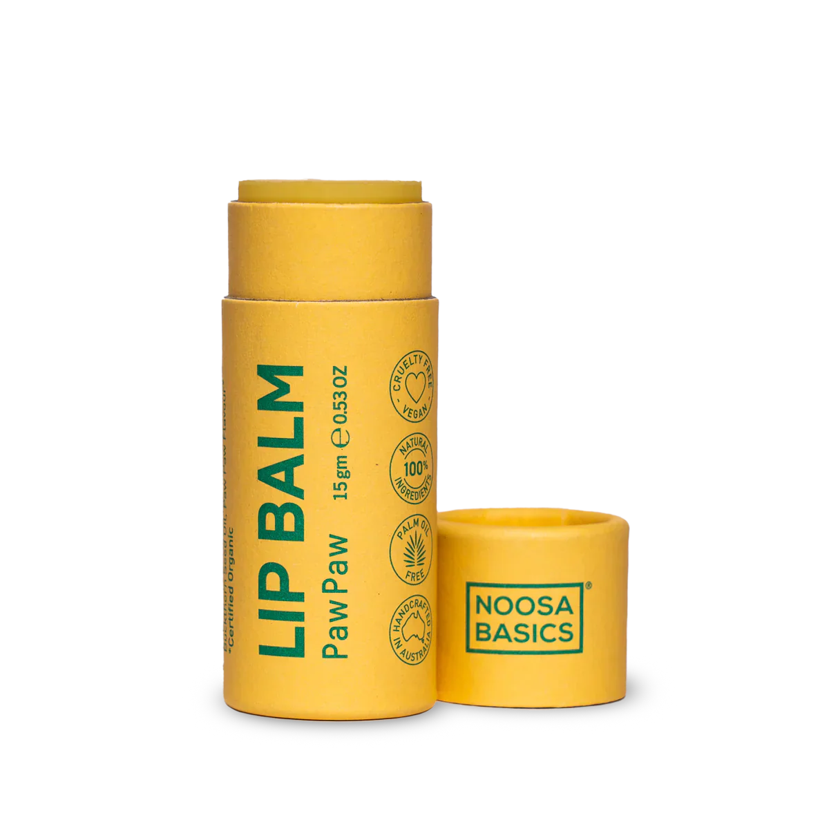 Yellow lip balm container with 'Noosa Basics' branding on a white background