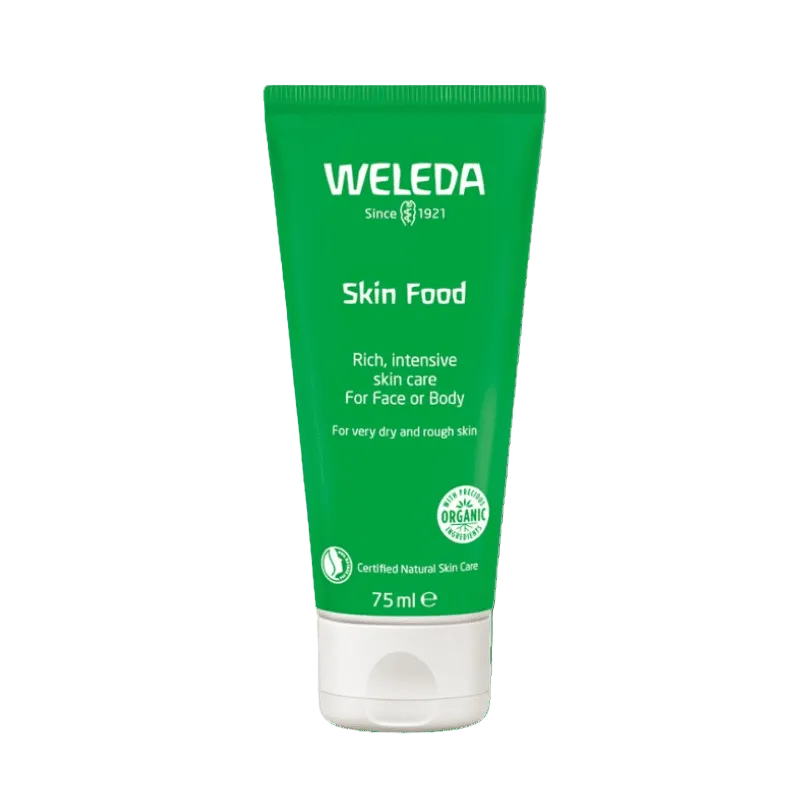 Green tube of Weleda Skin Food on a white background